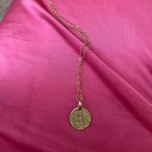 Gold hammered M necklace